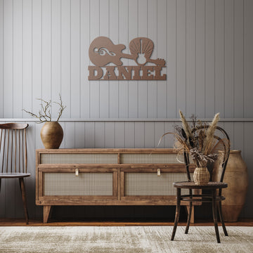 A cozy room with wood furniture, dried plants, and a large jug. On the wall is the Guitar Wall Sign with Pick and Custom Nameβa custom metal wall art piece that adds rustic charm and musical decor to the earthy setting.