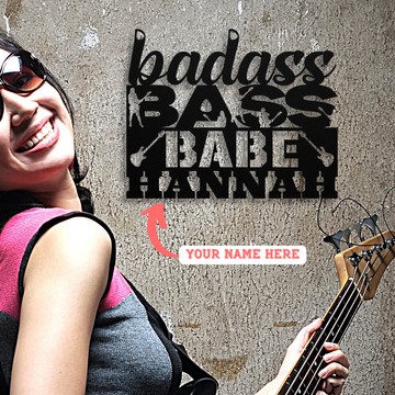 A woman in sunglasses holds a bass guitar beside a "Badass Bass Babe" metal sign, customizable with your nameβa perfect gift or custom wall art for female bass guitarists. Badass Bass Babe | CUSTOM Metal Wall Art for Female Bass Guitarist.