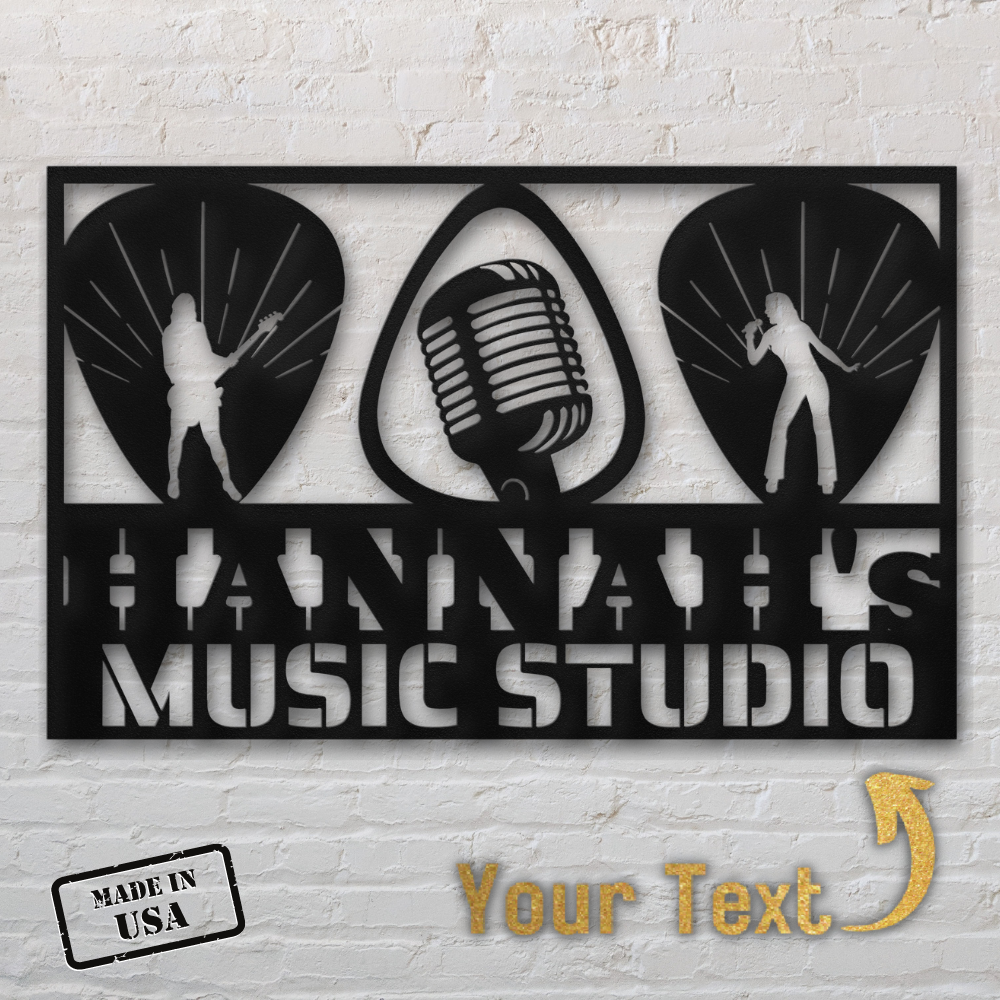 The Guitarist Singer Wall Sign Custom Name is a powder-coated steel sign featuring "HANNAH'S MUSIC STUDIO", musician silhouettes, microphone, guitar picks, a "Made in USA" stamp, and space for your custom text—all against a white brick wall.