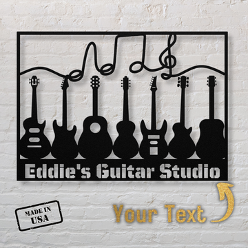 The Multiple Guitars Wall Sign with Music Notes and Custom Text is a powder-coated 18-gauge steel sign with six guitar silhouettes, a musical note, "Eddie's Guitar Studio," a "Made in USA" stamp, and custom text on a white brick wall background.