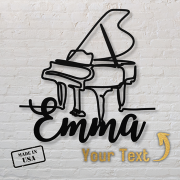 The Grand Piano Line-Art with Custom Name metal wall art features black piano artwork and your custom text in cursive, set on a white brick-style background. A gold arrow highlights your name. Includes "Made in USA" stamp—perfect elegant home decor.