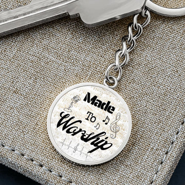 The Made to Worship Gold Sheet Music keychain, engraved with musical notes and a treble clef, makes an inspiring personalized gift for any singer or musician.