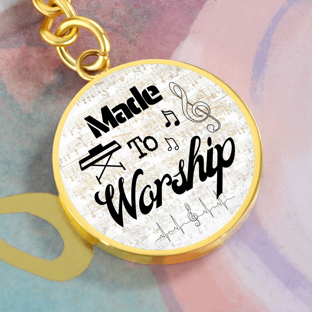 The "Made to Worship Gold Sheet Music | Keys" pendant features playful black lettering, musical notes, and soft pastel accents—an ideal engraved gift for a pianist or music lover.