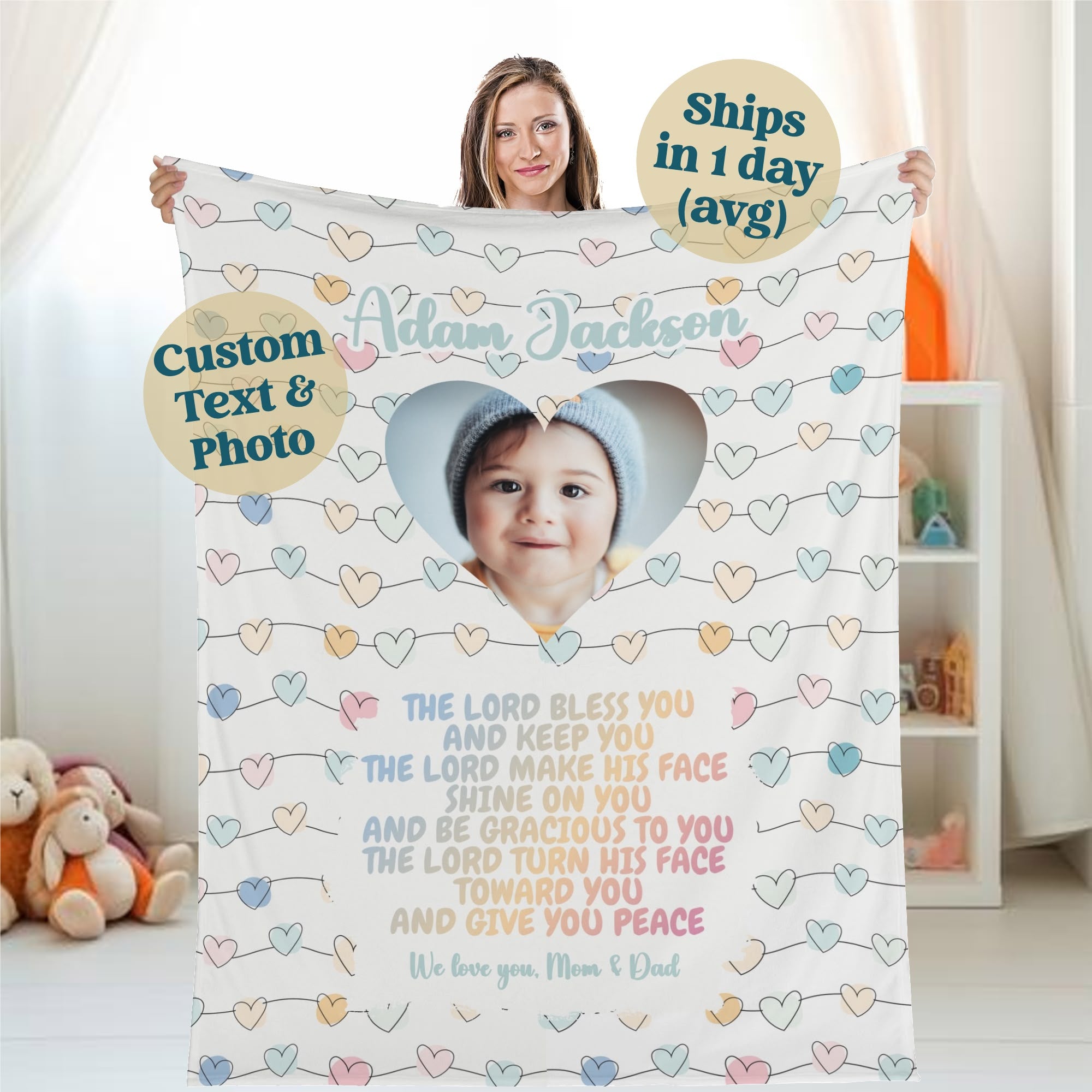 A woman holds a personalized baby name blanket that showcases a photo in a heart-shaped frame. The text includes a blessing and message from "Mom & Dad," while the pastel heart-patterned background enhances its charm. With customization options and fast shipping, this custom photo blanket gift makes the perfect baby blessing blanket.