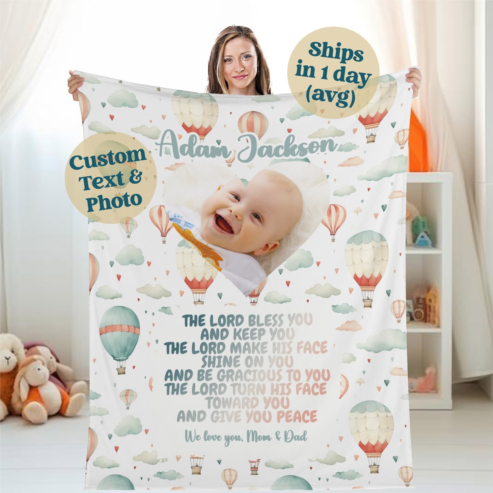 A woman holds a personalized baby name blanket, custom-designed with a photo of a smiling baby and the name "Aidan Jackson." This customized newborn name blanket features a hot air balloon theme adorned with a blessing. Text bubbles illustrate personalized text options and emphasize its fast shipping.