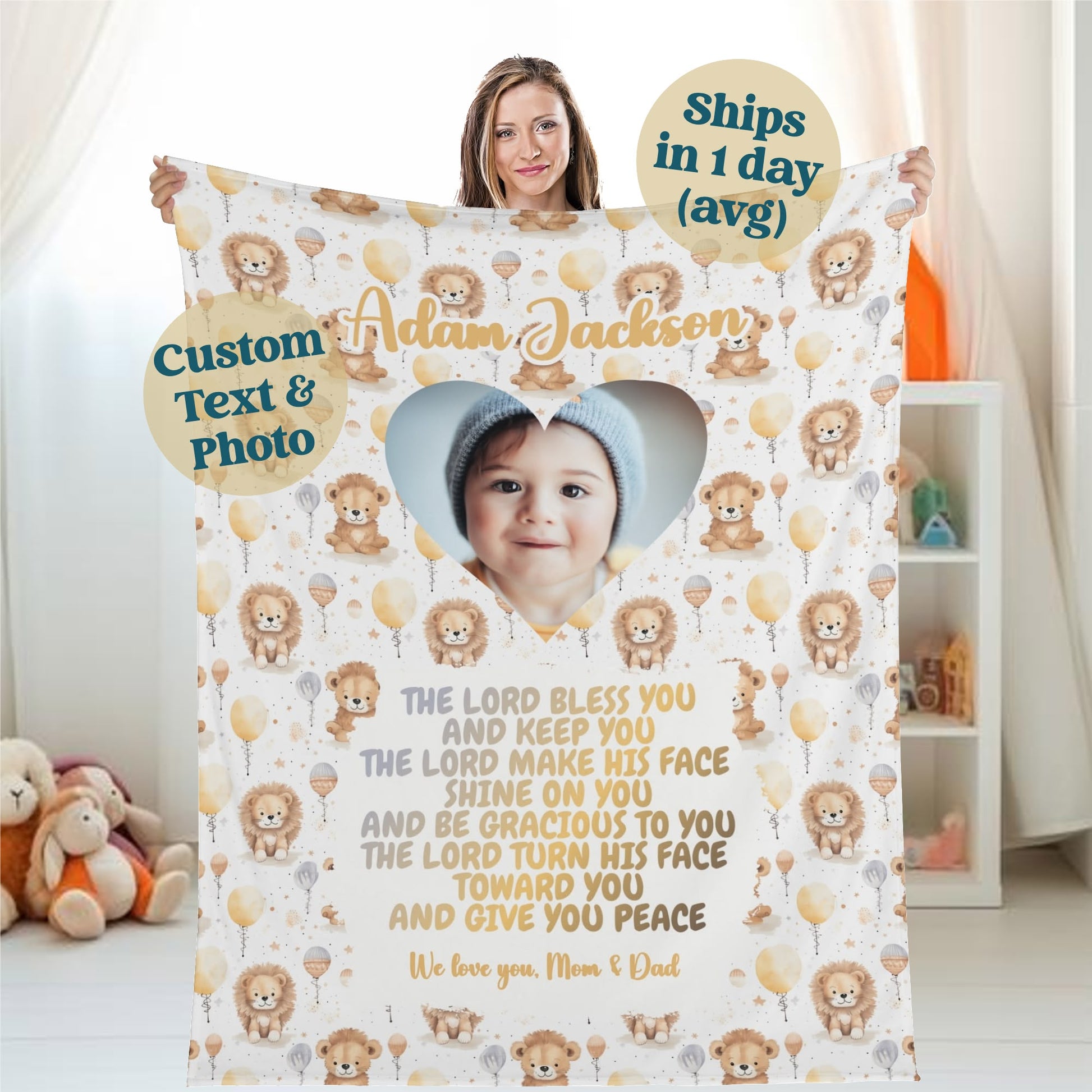 A woman proudly displays a Personalized Baby Name Blanket, customized with a heart-shaped photo of a smiling baby in a cap. The cozy blanket showcases a charming lion and balloon pattern, accompanied by personalized text. Its design elegantly highlights options for custom images and messages, making it an ideal gift for occasions such as baptisms, baby showers, or Christmas.