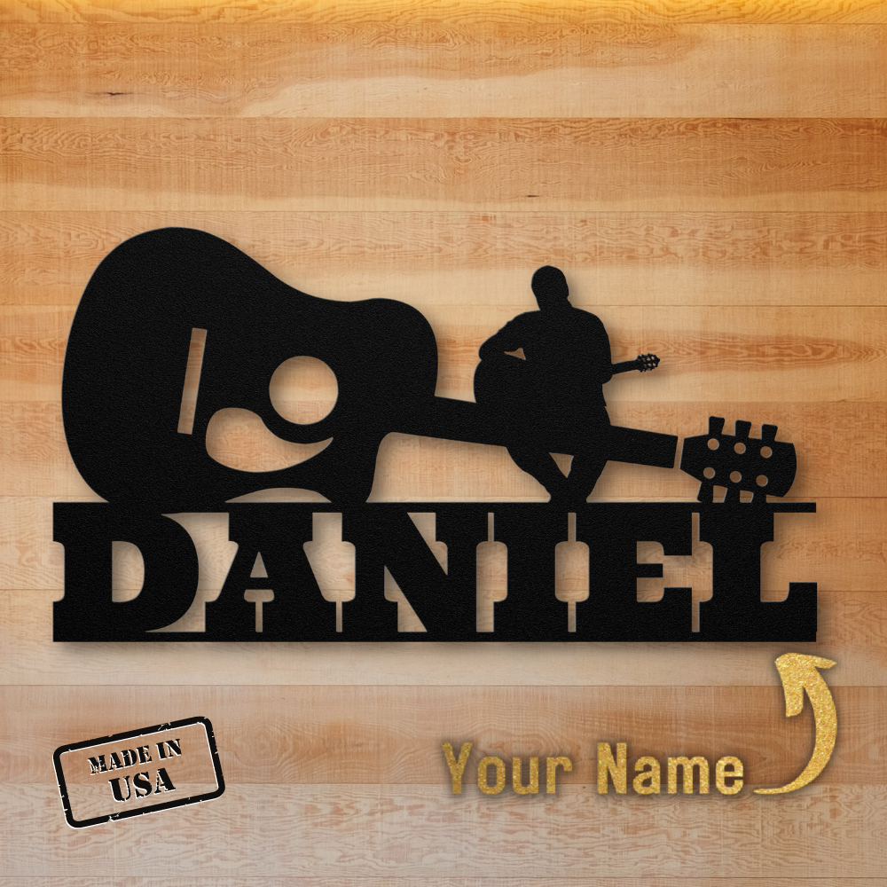 Personalized Acoustic Guitar with Sitting Guitarist Wall Sign Custom Name metal wall art with the name "daniel" cut out, perfect for music lovers wanting to add a touch of individuality to their space. Made in the USA.