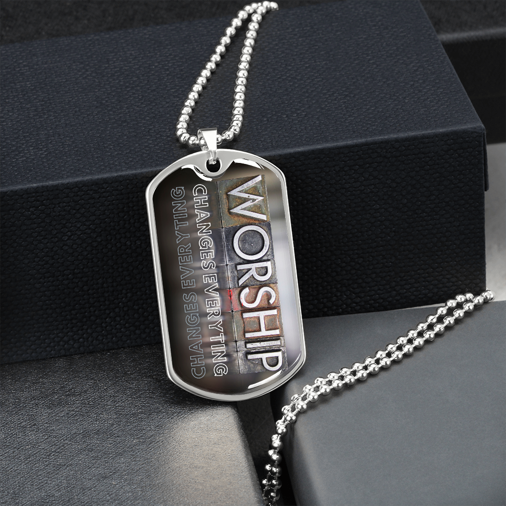 Worship military-style pendant necklace with bold vertical worship typography and “Worship Changes Everything” by a black gift box