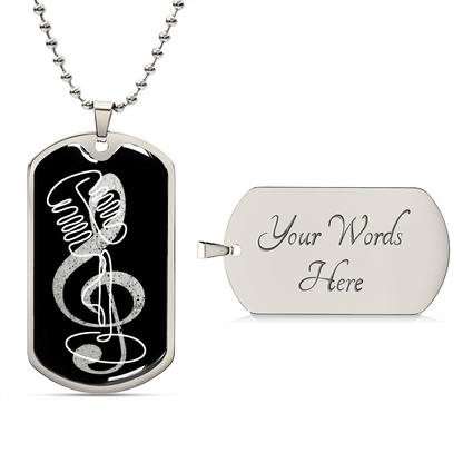 The Dog Tag Necklace Black | G-clef Cutout | Vintage Mic features a silver tag with a black front, showcasing a white microphone and treble clef design. The back is blank with "Your Words Here" for custom engraving or a personalized gift.