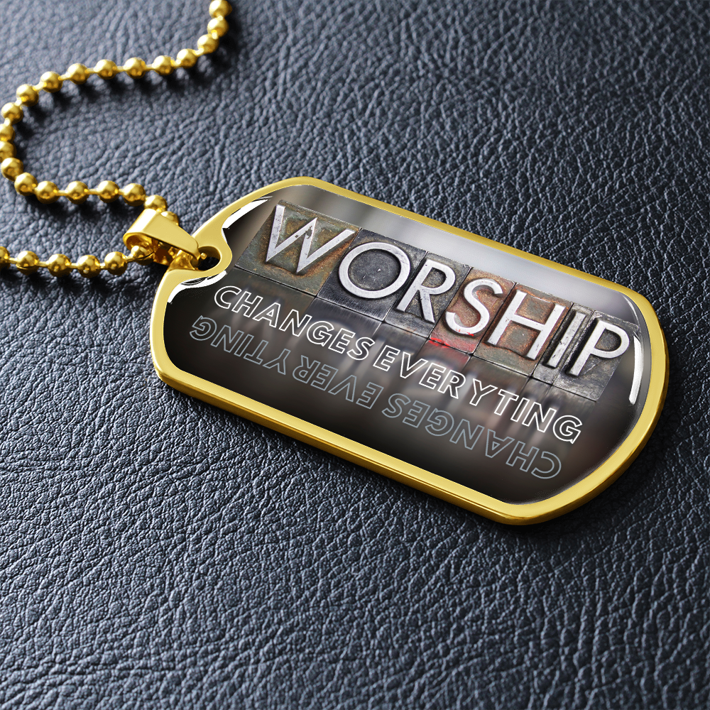 Worship Changes Everything Christian military-style necklace in gold finish with bold vertical worship typography on black leather